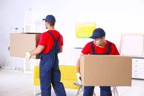 Greenwich Man with Van professional movers unloading a van