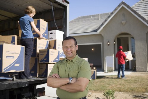 Professional movers packing boxes in Greenwich
